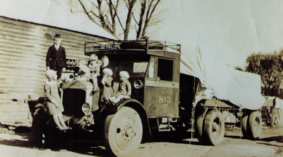 Dyers 1928-early automobile wiht kids sitting on it